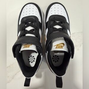 Nike Kids Black, White, and Gold Sneakers